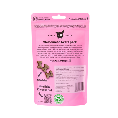 Pink packaging of Axel's Elixir dog treats with text and QR code on a white background